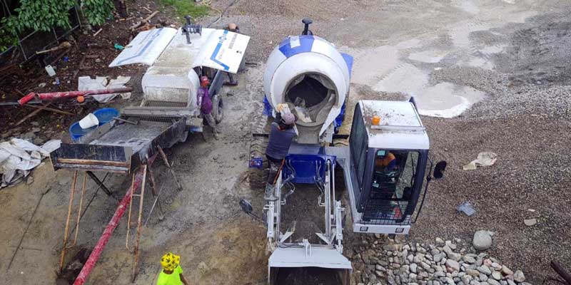 concrete pump static and self loading mixer working on-site