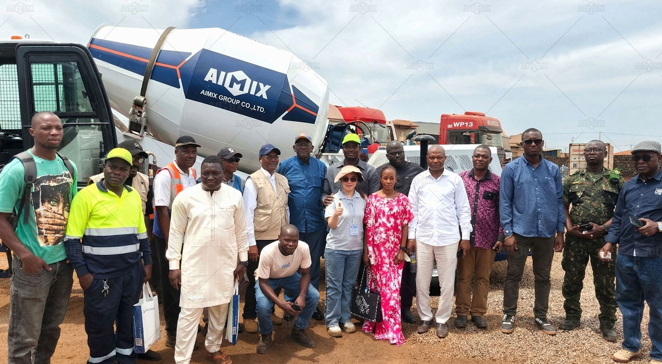live demonstration of a self-loading concrete mixer for local contractors in Guinea, showcasing its features and functionality
