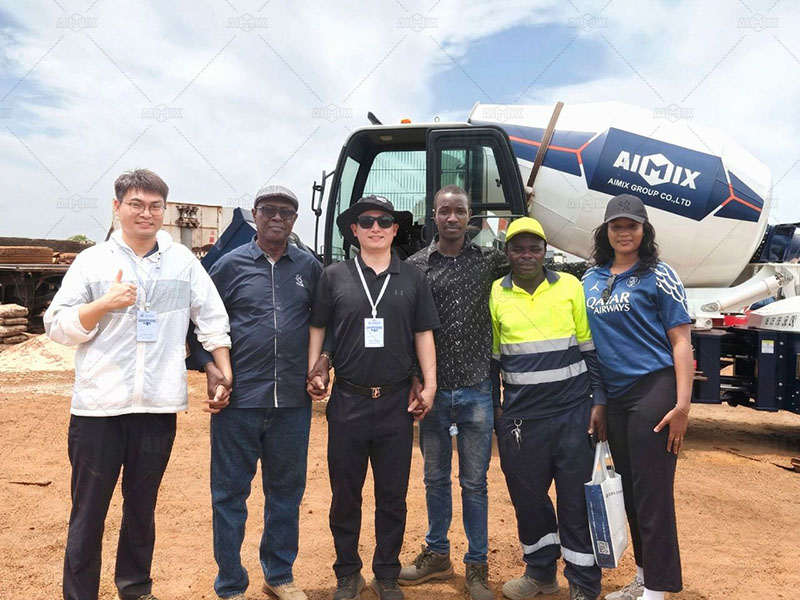 Guinea clients highly praising AIMIX concrete mixer after operating it during a live demo, impressed by its performance