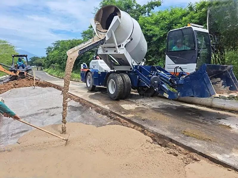 Road Construction With Self Loading Concrete Mixer